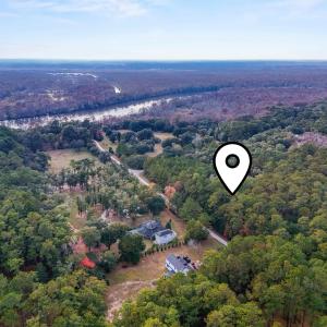 Aerial view of property and surrounding area with