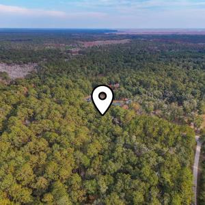 Aerial view of property and surrounding area featu