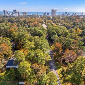 Aerial view of property's location with city skyli