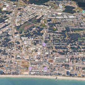 View of property location with a nearby body of wa