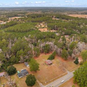 Aerial view of property and surrounding area with