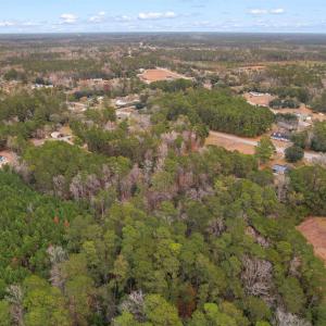 Aerial view of property and surrounding area with