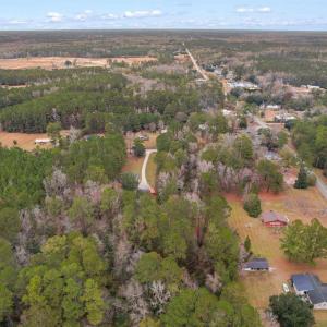 Aerial view of property and surrounding area with