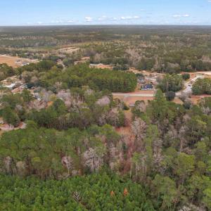 Aerial view of property and surrounding area with