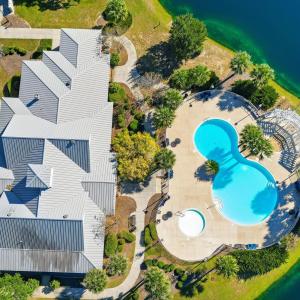 Drone / aerial view of a pool and a large body of