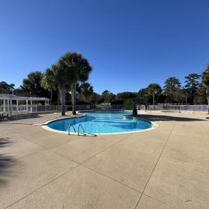 Community pool with a patio area