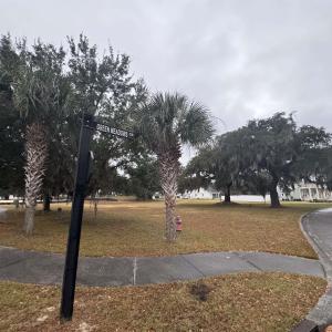 View of home's community featuring a yard