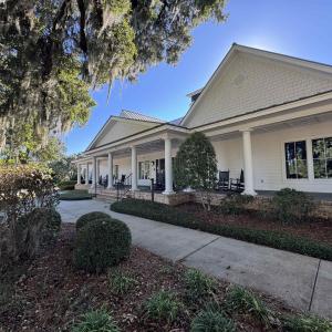 View of property exterior featuring covered porch