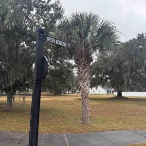 View of community featuring a lawn