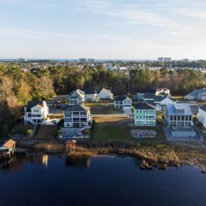 Aerial view of residential area with a large body