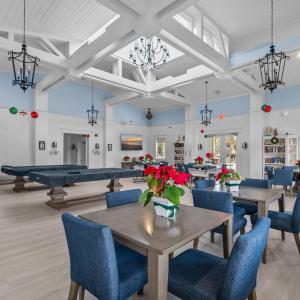 Dining area with wood finished floors, a high ceil