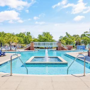 Community pool with a patio area and stairs