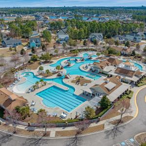 Aerial view of residential area featuring a pool a