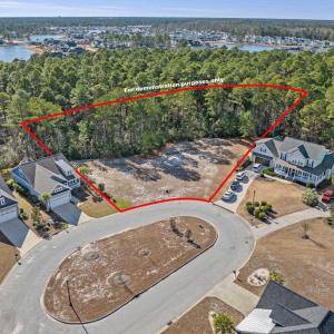 Aerial view of residential area with a nearby body