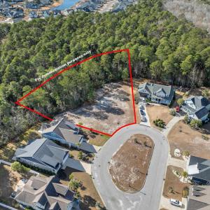 Aerial view of residential area with a forest. Bou