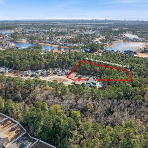 Aerial view of property and surrounding area with