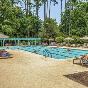 Community pool with a patio
