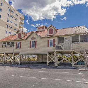 View of property with stairs