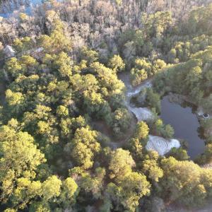 Aerial view of property and surrounding area with