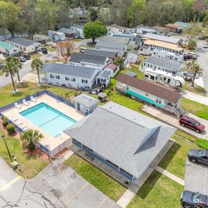 Aerial perspective of suburban area with a pool ar