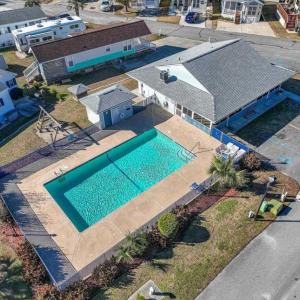 Aerial perspective of suburban area with a pool ar