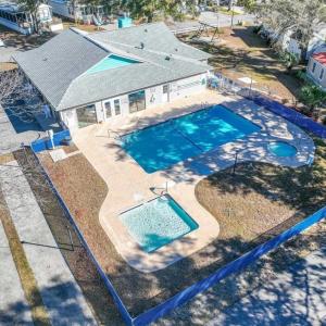 View of subject property featuring a pool area