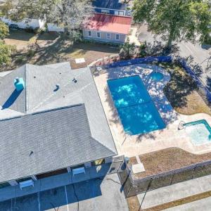 View of subject property featuring a pool area