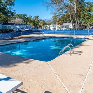 Community pool featuring a patio area and a reside