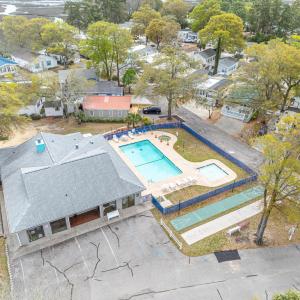 Aerial view of residential area featuring a pool