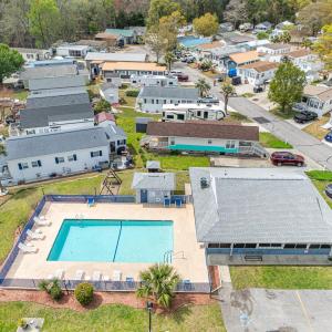 Aerial perspective of suburban area with a pool