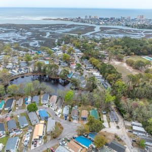 View of property location with a nearby body of wa
