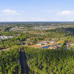 Aerial view of property and surrounding area with