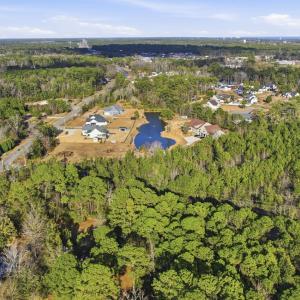View of property location featuring a forest