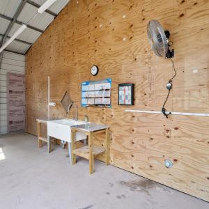 Misc room featuring concrete flooring, a garage, a