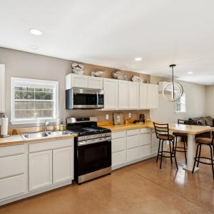 Kitchen featuring concrete floors, decorative ligh