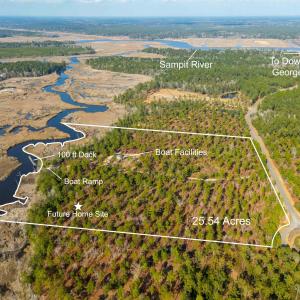 Aerial view of property and surrounding area with