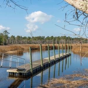 Dock area featuring a water view