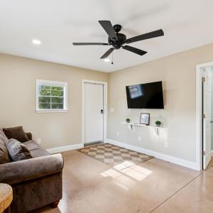 Living area featuring finished concrete floors, re