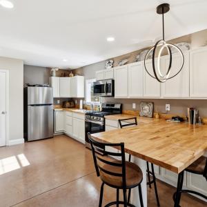 Kitchen with white cabinets, stainless steel appli
