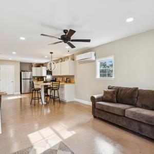 Living area featuring finished concrete floors, re
