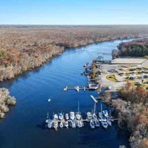Drone / aerial view of a heavily wooded area and a