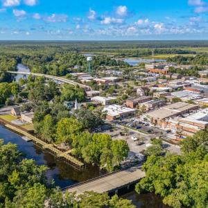 Aerial view of a notable bridge and a large body o