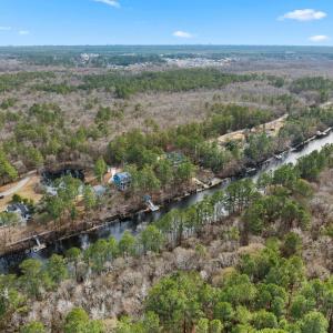 Aerial view of property and surrounding area with