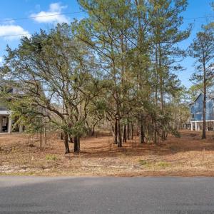 View of yard with covered porch and stairway