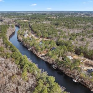 Aerial view of property's location with a heavily