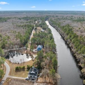 Aerial view of property and surrounding area with