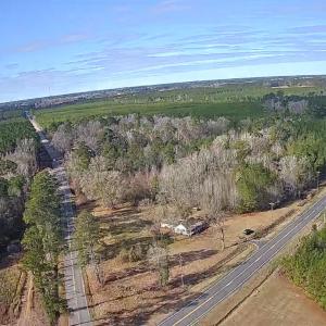 Aerial view of property's location with a forest