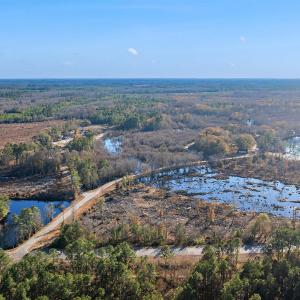 Aerial view of property and surrounding area with