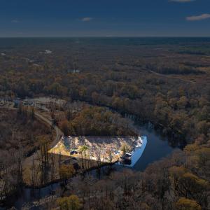 View of property location with a forest