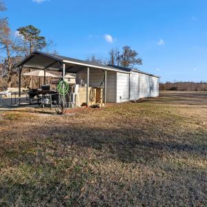 View of the property featuring fencing, a gazebo a